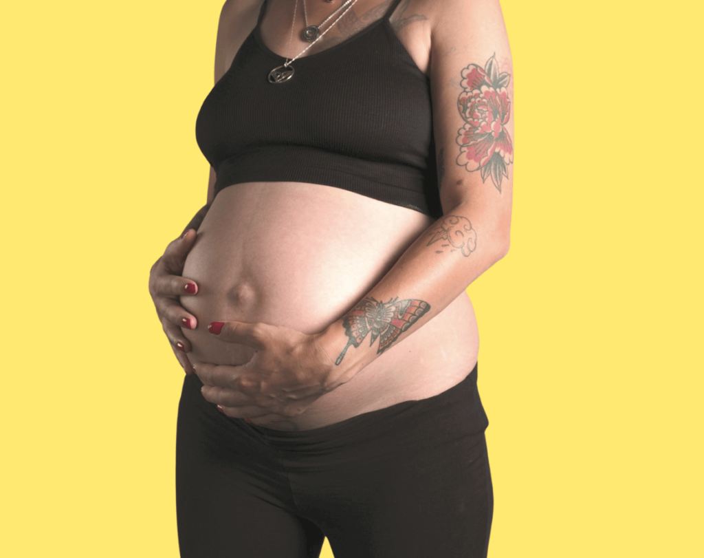 Pregnant tattooed woman hypnobirthing online